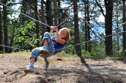 A kid is playing in the low high track