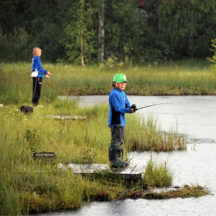 Two boys are fishing 