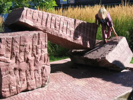 Children playing on large boulders.