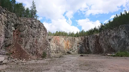 Cliffs surrounding an open area.
