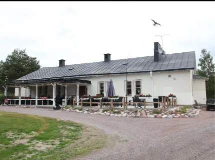 A white building with patio.